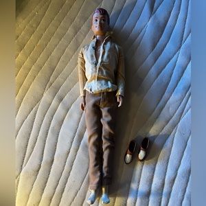 Vintage 1960s Mattel Allan doll with Ken clothing.